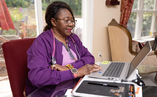nursing student works in her home