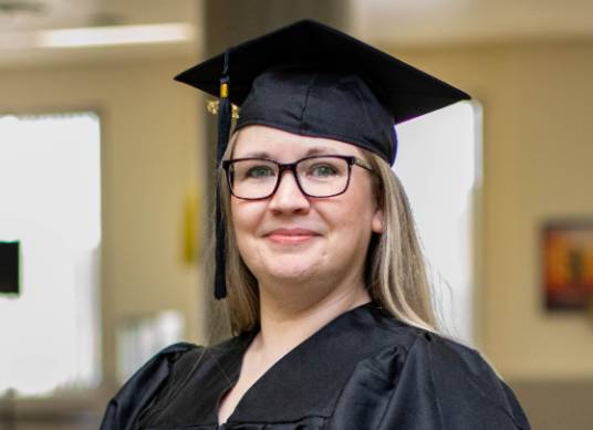 Jeanette B. at commencement in Rochester.
