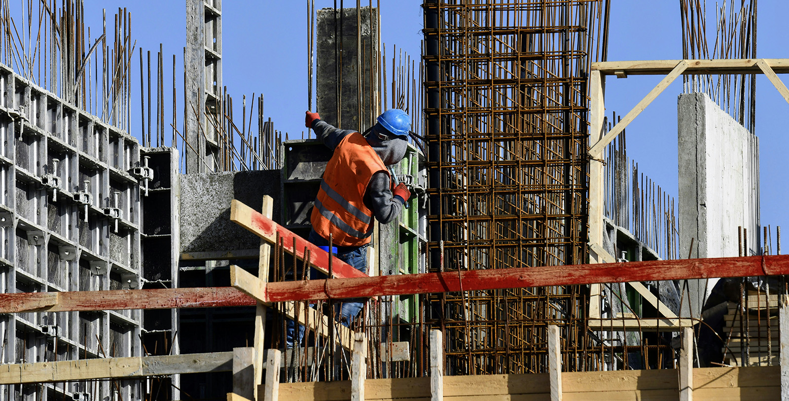 person working on building under construction