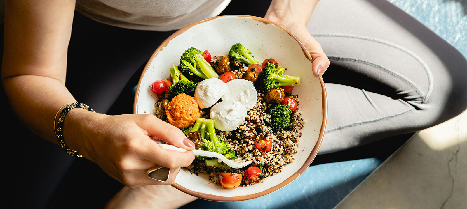person holding a bowl of food