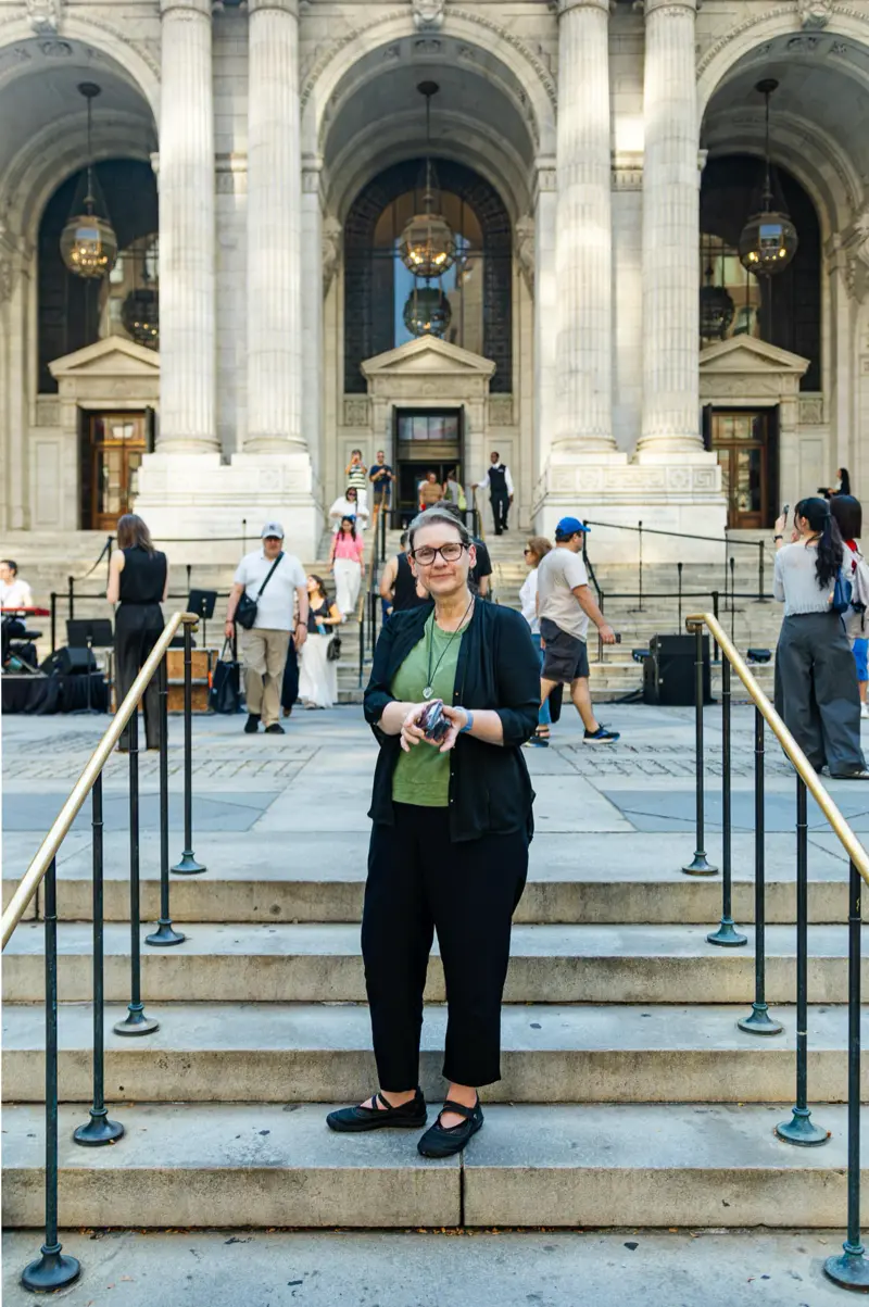 Pam Yoder at the New York Public Library with some of her video cassettes.