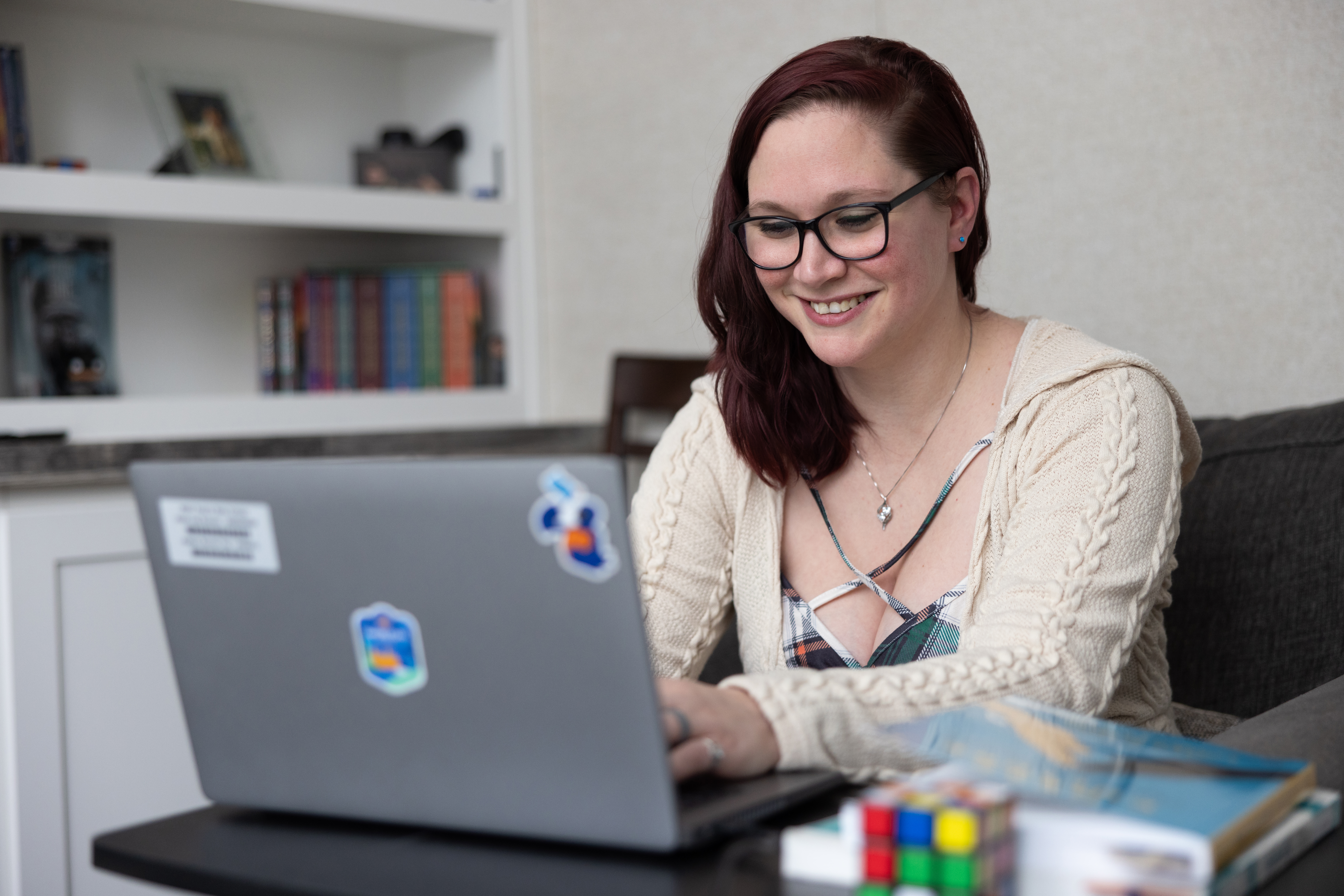 Woman works on a laptop computer.